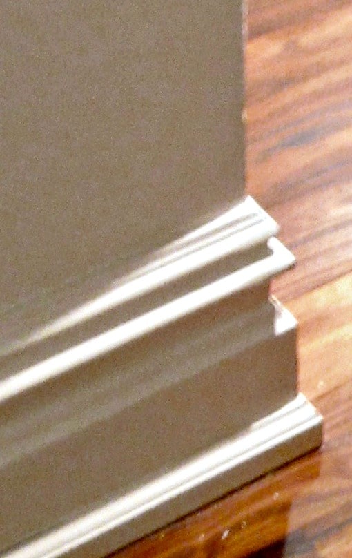 Door stop molding painted white and used as shoe molding