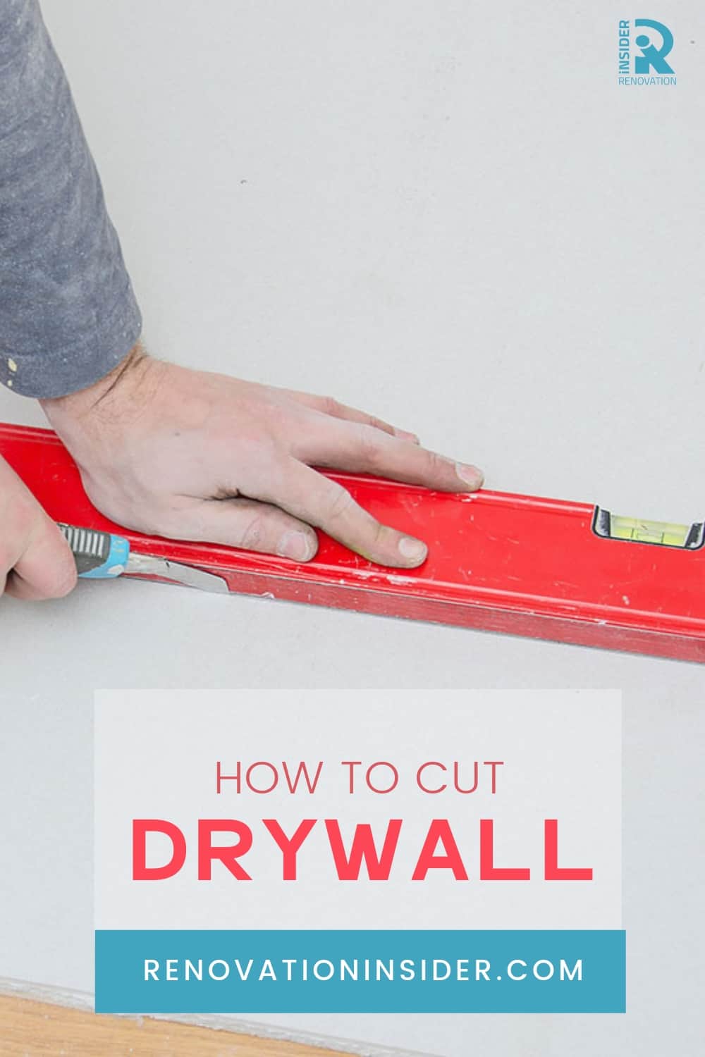 Man Cutting Drywall with a Level